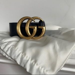 Black and gold Gucci belt
